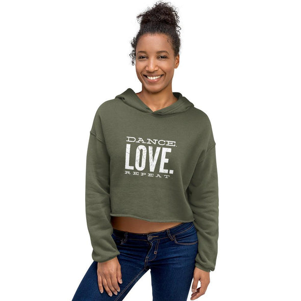 happy black woman wearing a military green dance crop hoodie and jeans